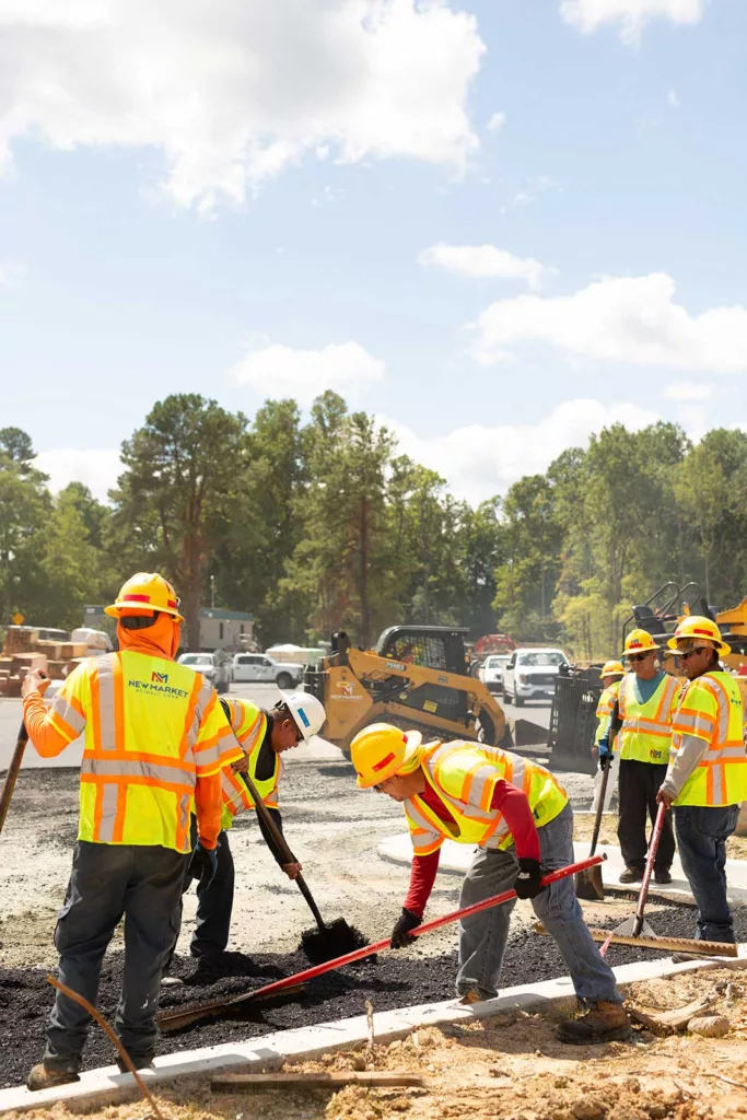 Workers spreading gravel